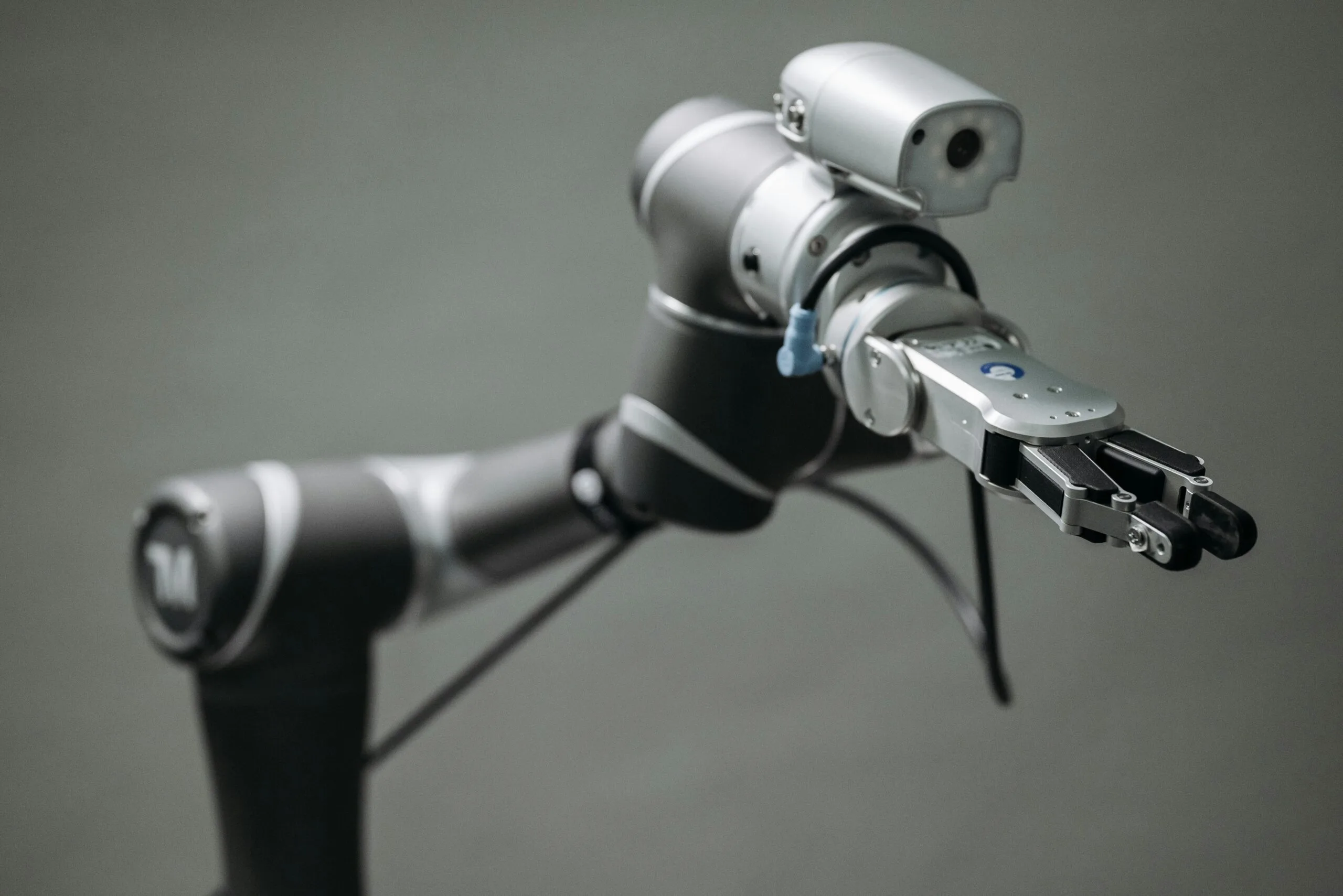 Close-up view of a robotic arm equipped with a video camera, showcasing modern technology.